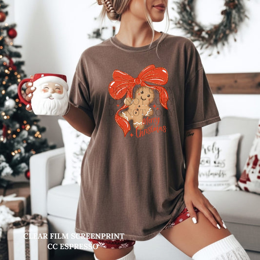 Gingerbread Man hanging from a Bow tee