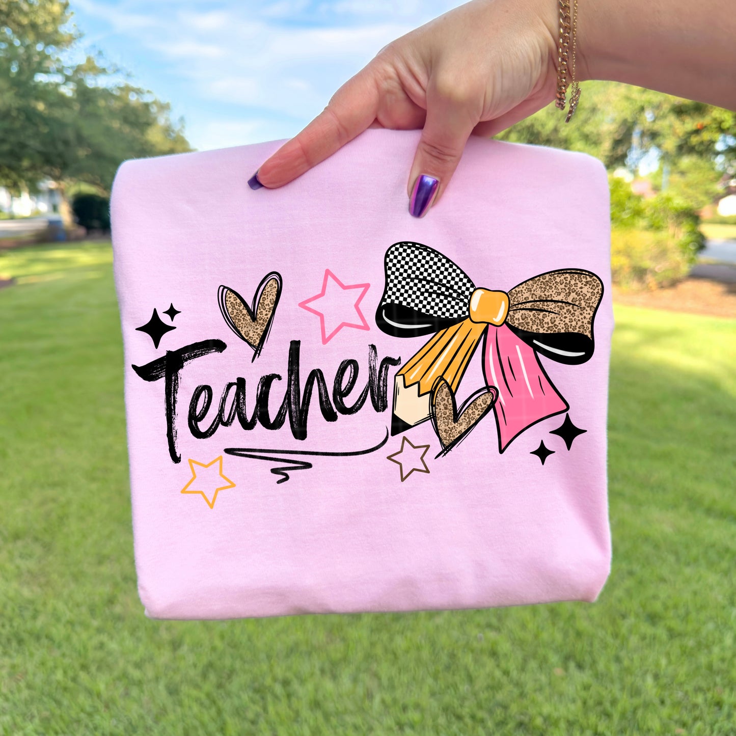 Teacher with pencil bow tee