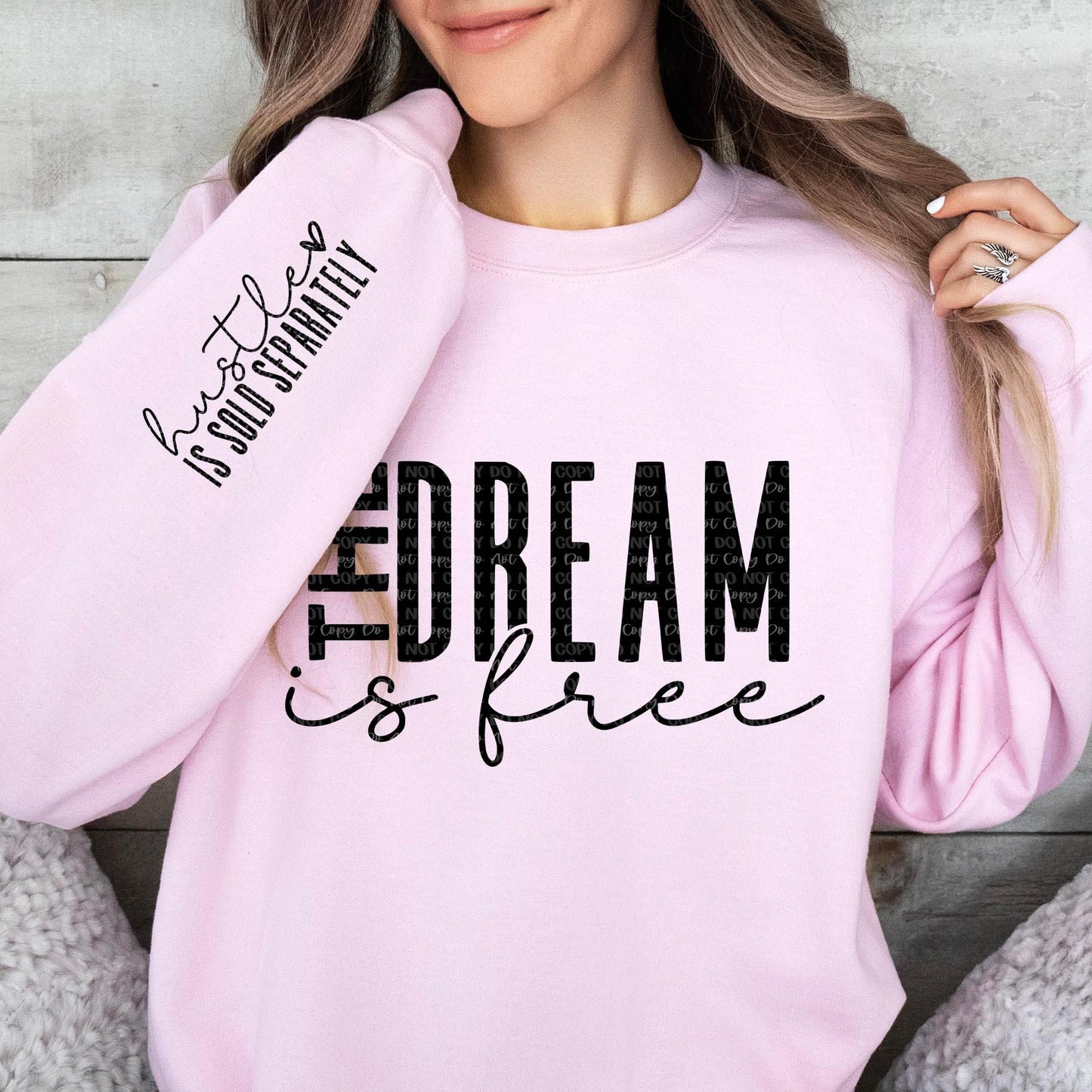 The Dream is Free Hustle is sold separately sweatshirt with sleeve design