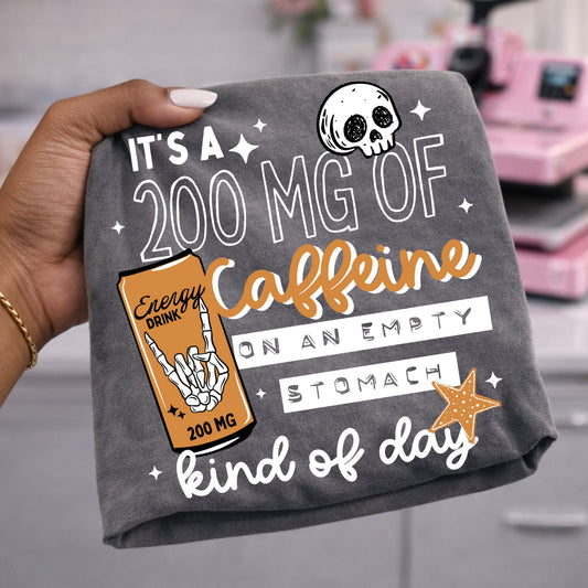 It's a 200 mg of caffeine kind of day tee (White Ink)