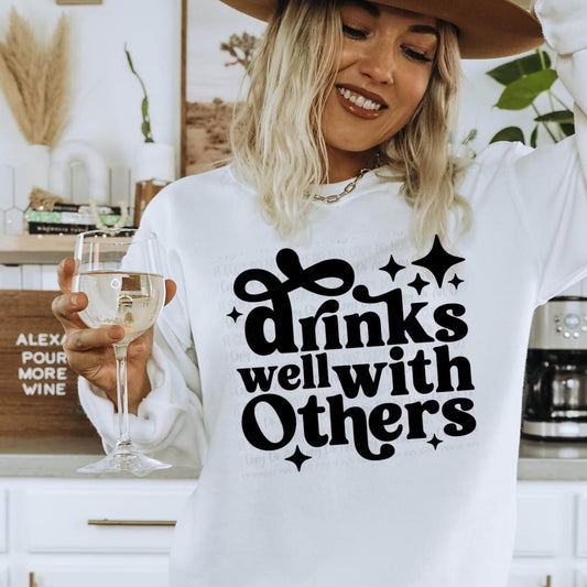 Drinks well with others tee