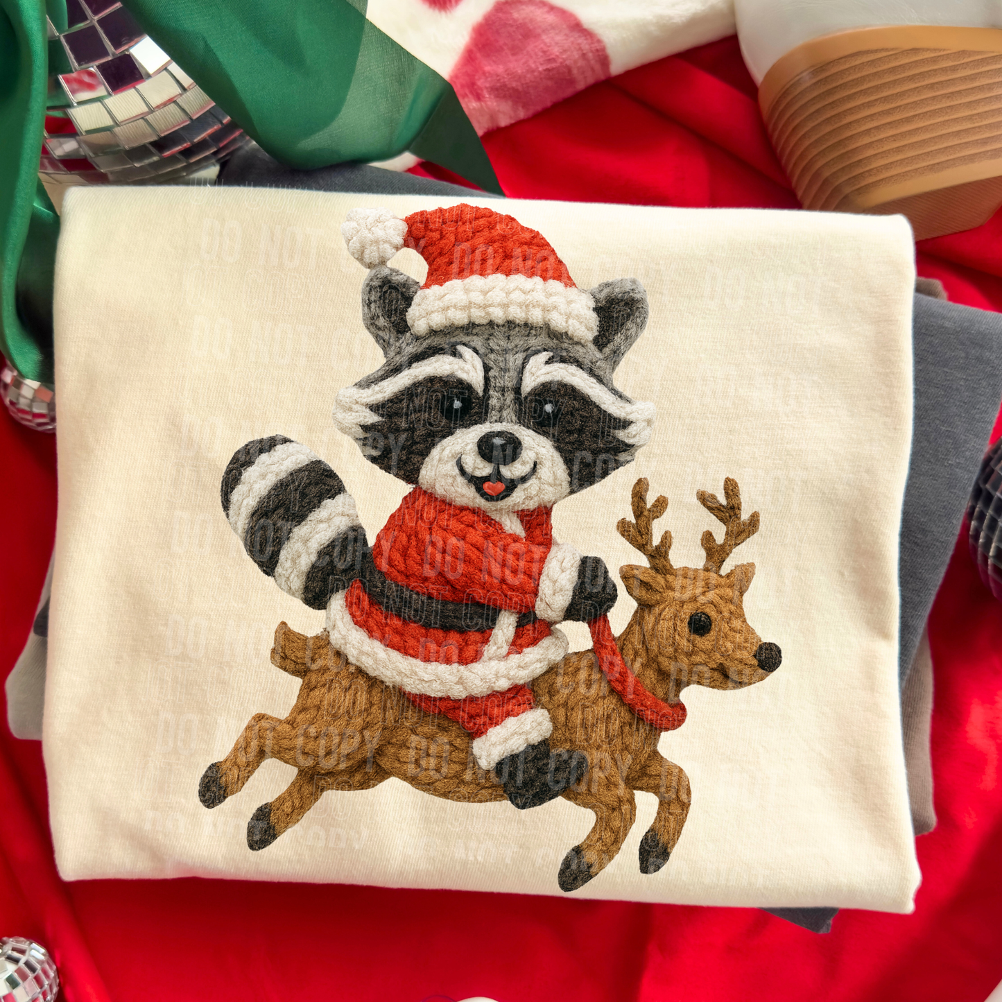Raccoon riding reindeer faux yarn tee